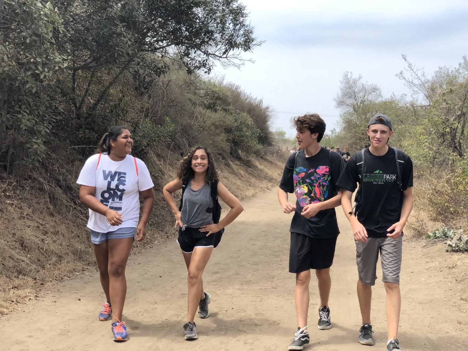 Ava Sinha ('20), Caroline Metyas ('20), Ian Igleheart ('20), and Jacob Weigand ('20) happily make their ways up a physically demanding hill.