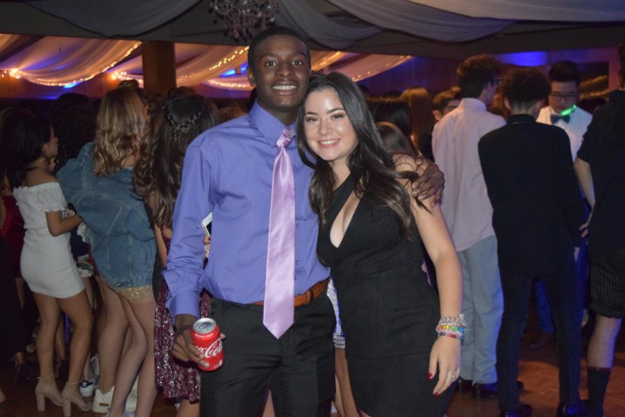 Emily Schoffman (‘19) and Nick Johnson (‘19) take a break from the dance floor behind them. 