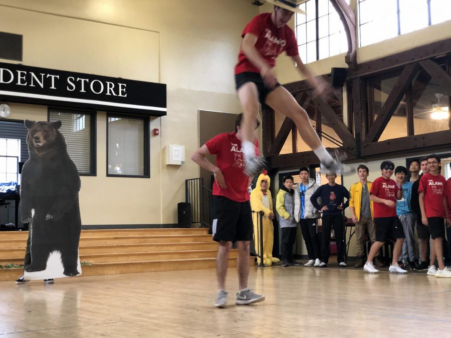 JP Calderoni (19) and Willy Martinez (19) perform a stunt in the middle of the Alamo dance.