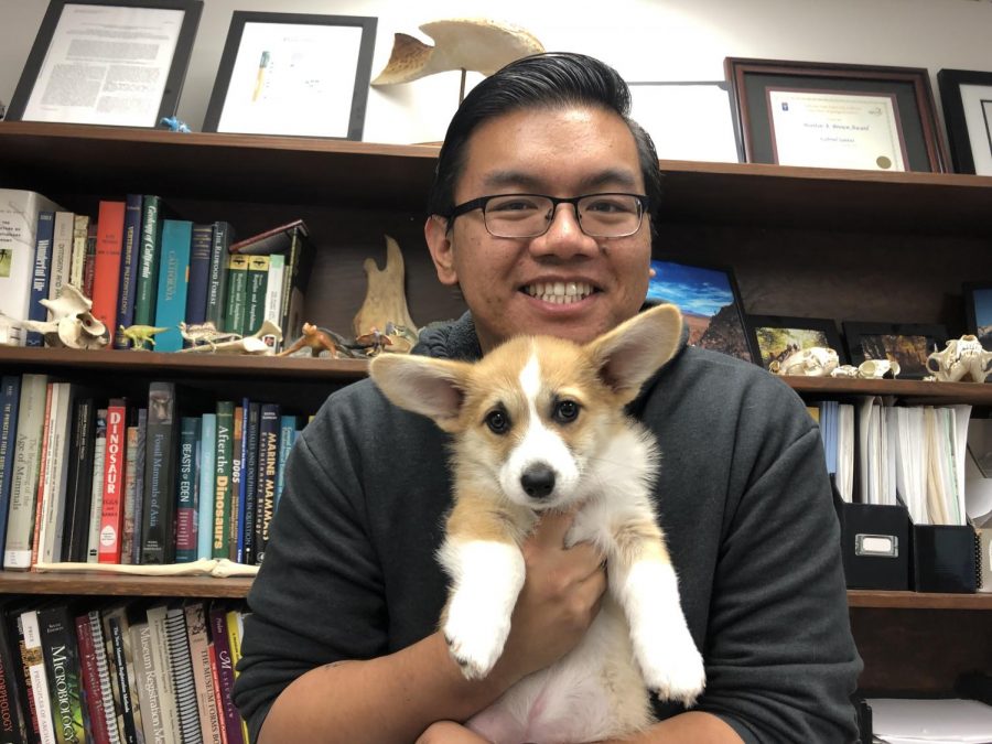 Mr. Santos holds Roxas for a picture.