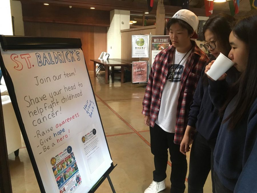 Cathy Wang (‘22), Fiona Jiang (‘22), and Joyce Jiang (‘22) each ponder signing up to shave their head for the St. Baldrick’s event on Saturday morning, March 30th. 