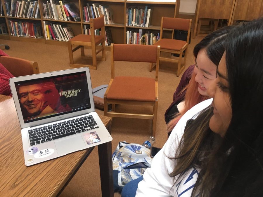 Ava Sinha (‘20) and Renny Jiang (‘20) watch the thrilling true crime documentary, Conversations with a Killer: The Ted Bundy Tapes, together in the library. 