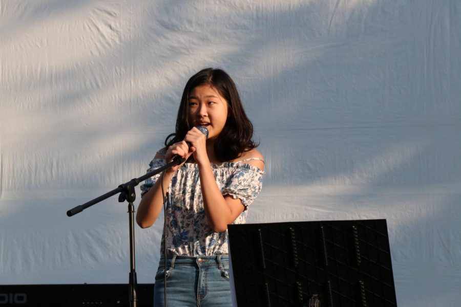 Joanna Yap (22) sings at her first Jubilee. 