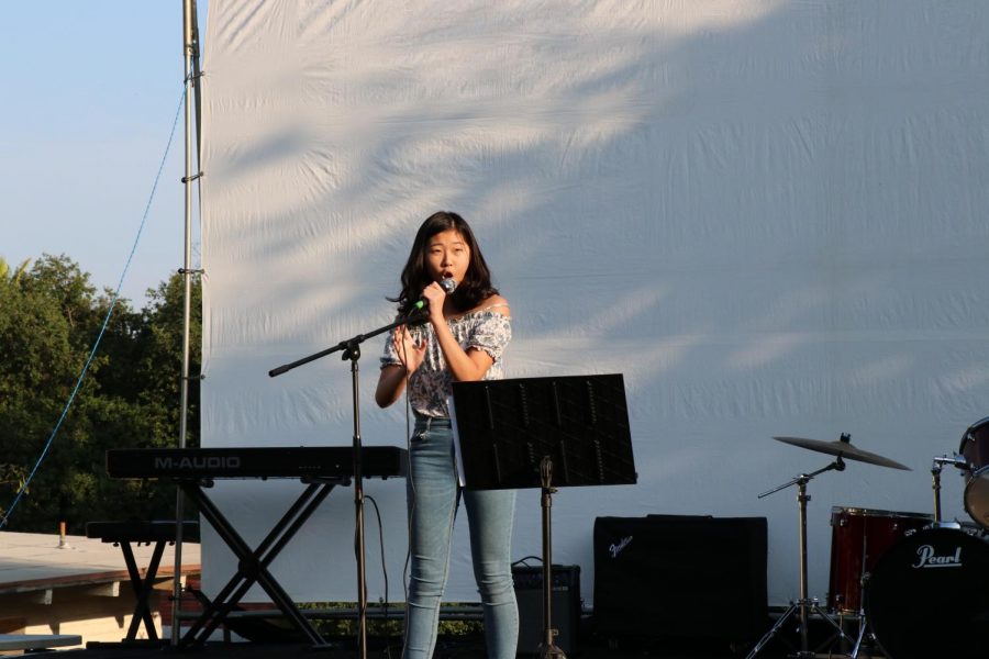 Joanna Yap (22) sings onstage. 
