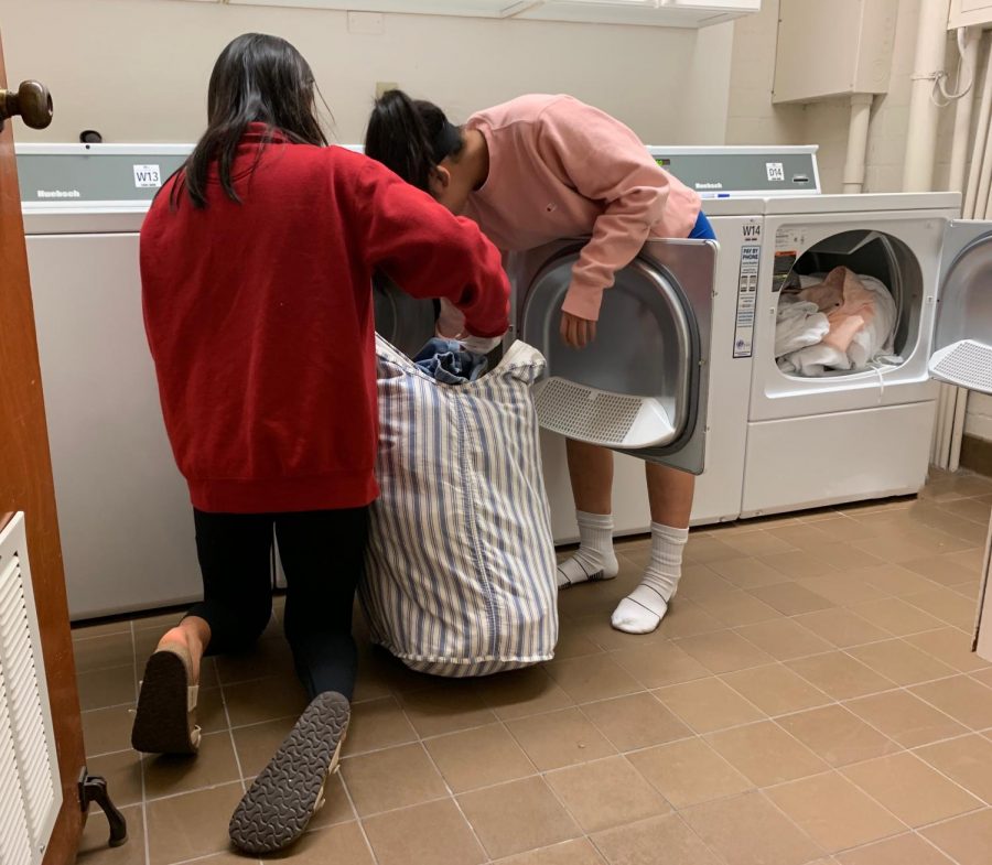 Jones residents Sara Hagiwara ('20) and Sydney Wuu ('20) do their laundry with the new laundry facility.