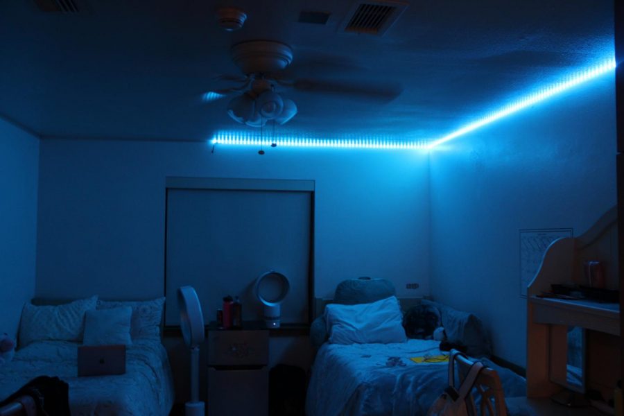 Angie Chen ('20) and Alia Al-Turki’s ('20) room glows in blue in the dark. 