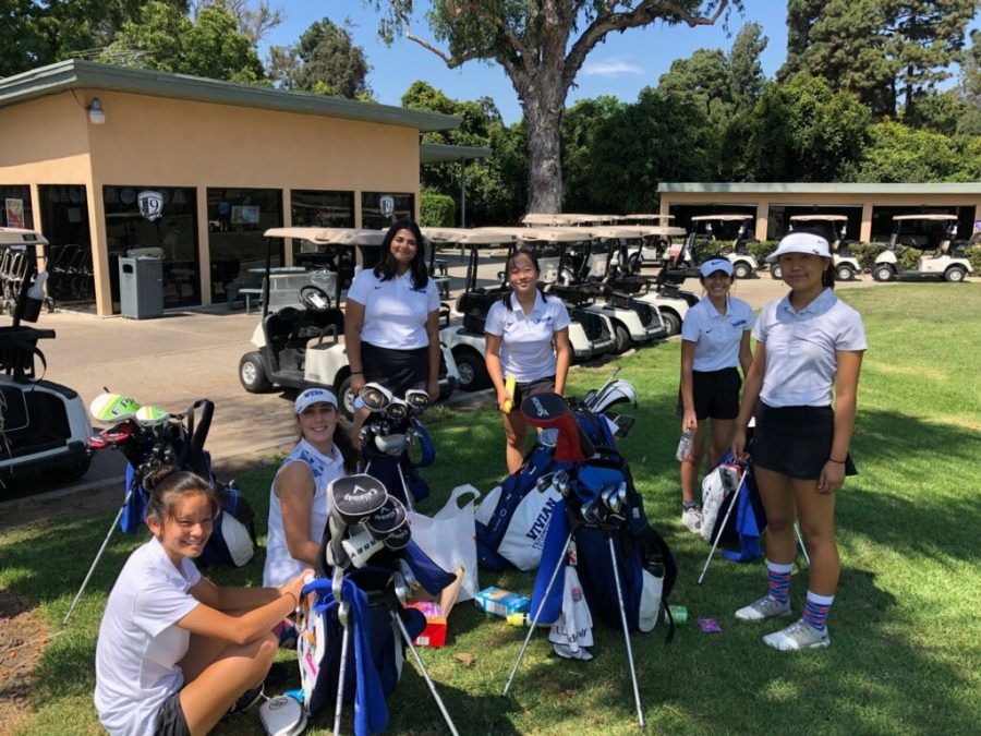 The VWS golf team smiles at a competition.