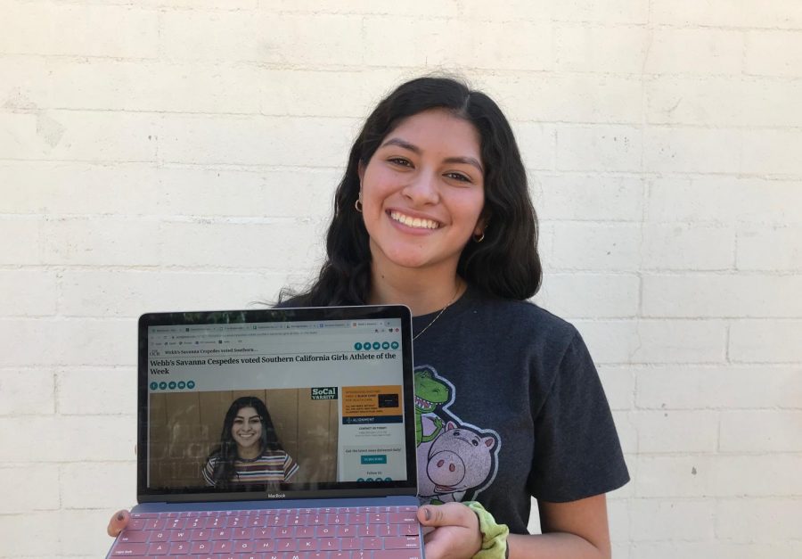 Savanna Cespedes (‘22) holds open the website announcing her victory.