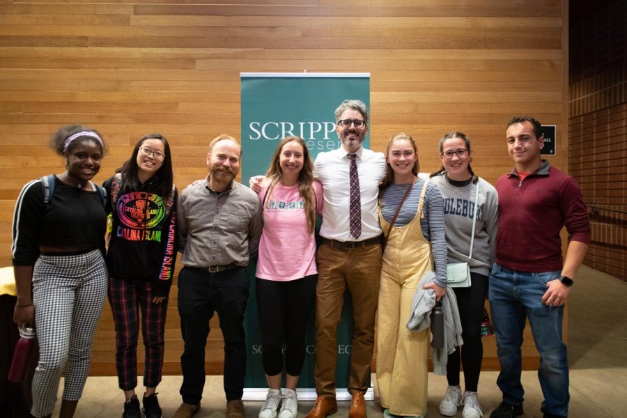 Janina Akporavbare (‘22), Sunny Yu (‘22), Dr. Dzula, Bianca Arteaga (‘22), Nichola Monore (‘22), Laura Haushalter ('21), and Mo Igbaria (‘20) pose for a photo with Michael Barbaro after listening to his talk.