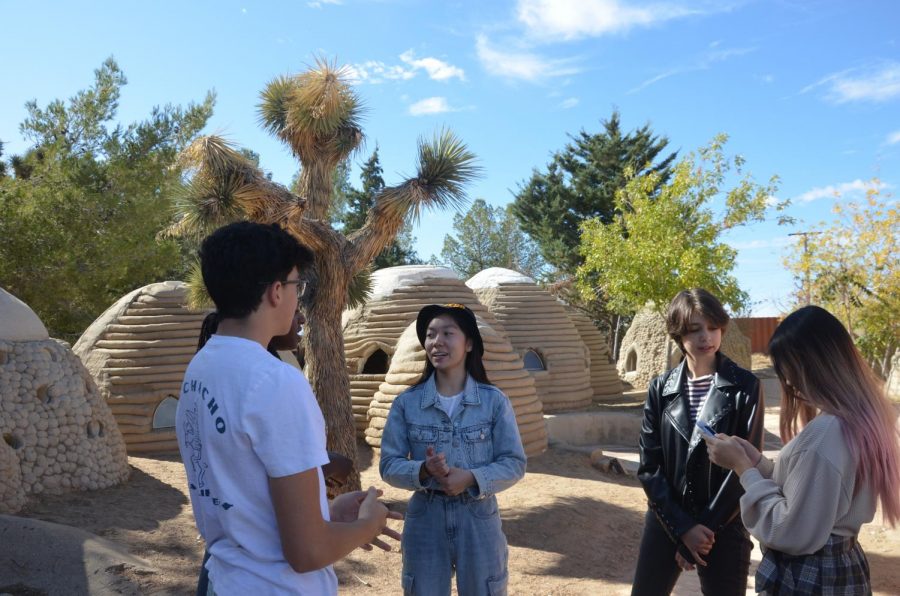 Webbies+converse+at+the+California+Institute+of+Earth+Architecture+while+surrounded+by+models+of+SuperAdobe+structures.