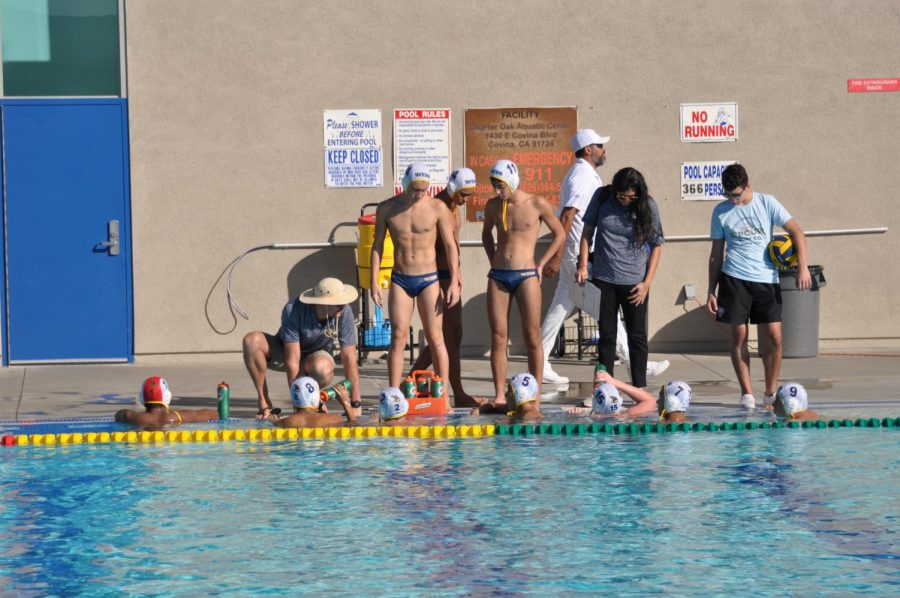 Head Coach Howie Kalter gives the varsity team advice during a timeout.
