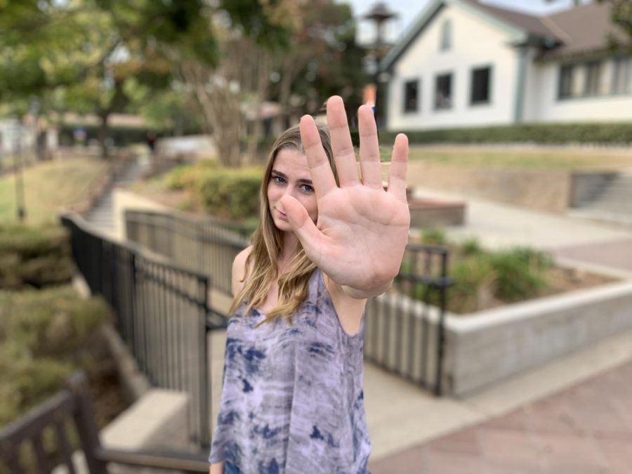Victoria Romero (‘20) raises her hand to take a stand with “Ok, boomer.”