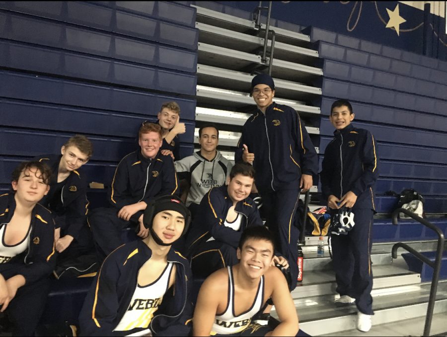 Wrestlers pose for a picture at the start of the tournament. 