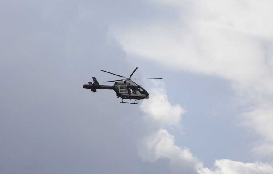 A helicopter makes its appearance in the sky in the wilderness area behind Faculty Field. Graphic Courtesy of Scott Nichols.