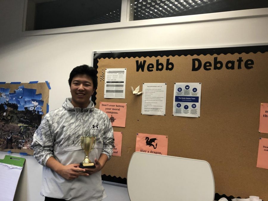 Hanson Hu (‘23) holds the second place trophy.