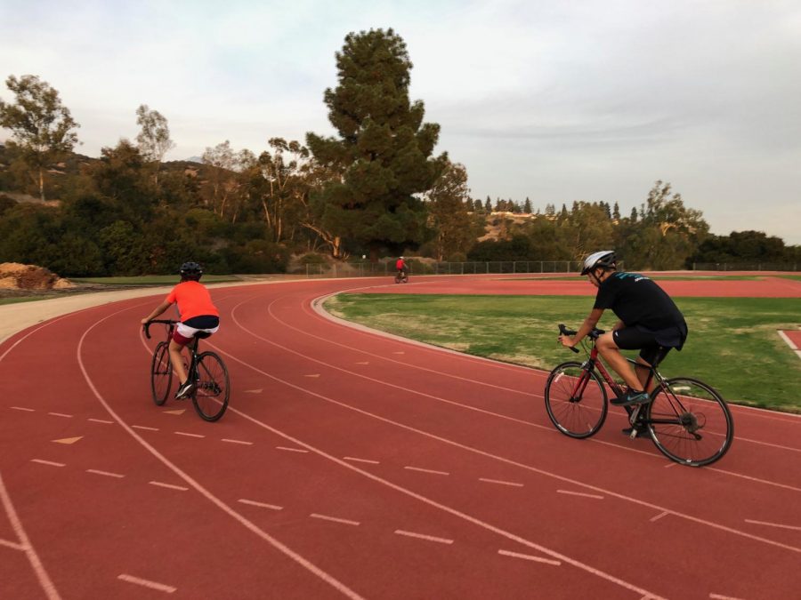 Triathletes race around Faculty Field.
