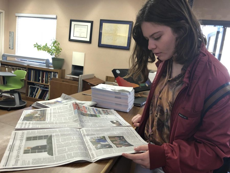 Eleanor Corbin (‘20) reads through the newspaper that covers the impeachment of Donald Trump.