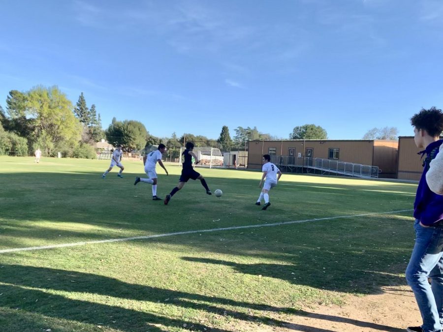 Justice Thomas ('21) intently watches the action-packed soccer game.