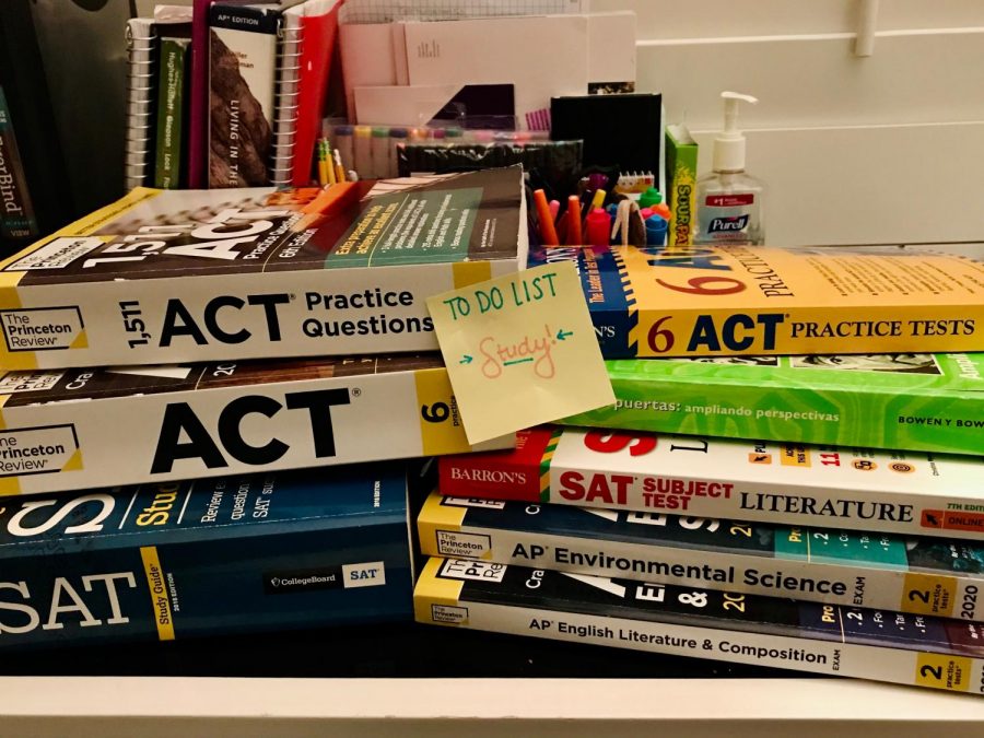 A pile of practice test books awaits. 