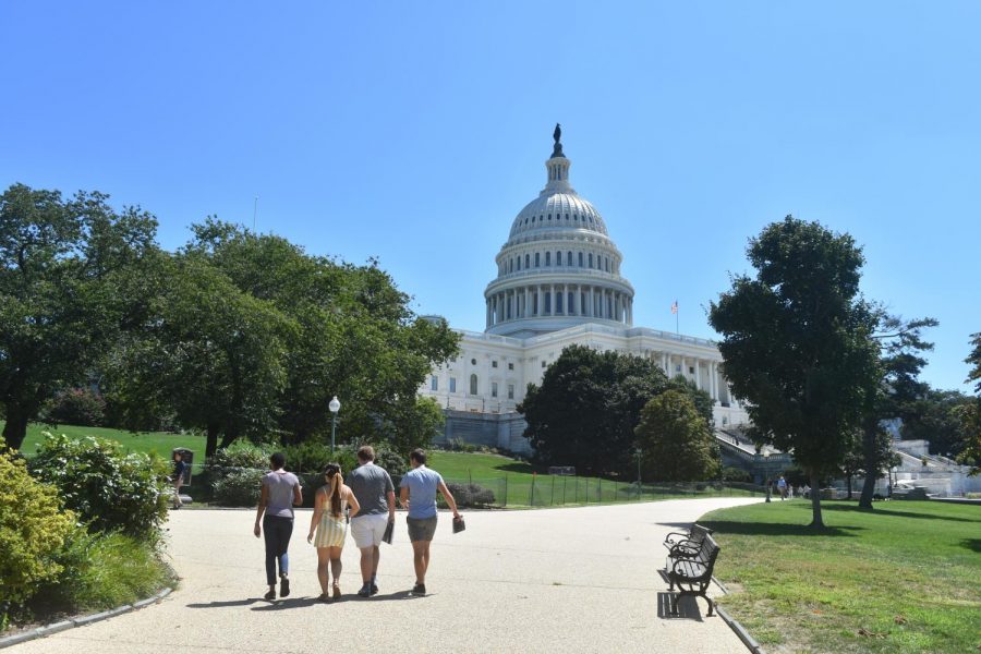 Students from the School for Ethics and Global Leadership Fall 2019 semester walk past the Capitol Building on their way back to the dorms after spending the day at the Smithsonian National Gallery of Art.