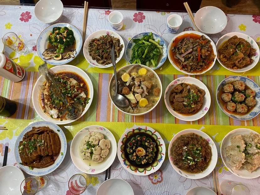 Fiona Jiang (22) eats a huge traditional meal with family.