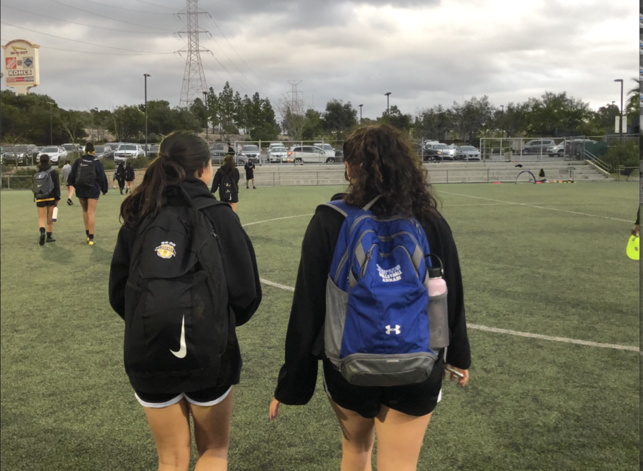 Eva Annabi (‘23) and her friend walk together after club soccer practice.
