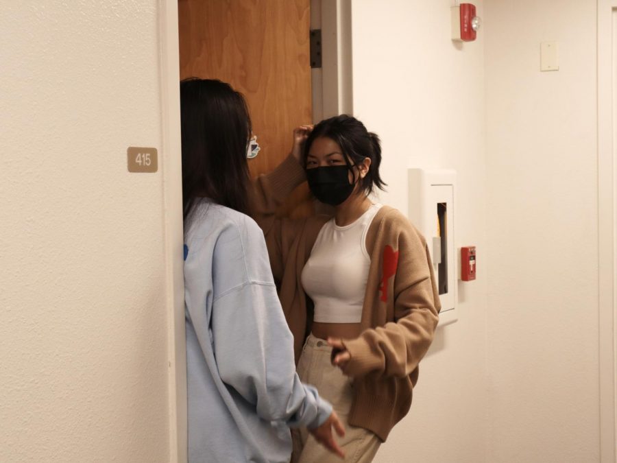 Britney Lu (‘23) and Jolina Zhao (‘23) stand in the doorway chatting before study hours start. 
Credit: Sharon Xu (22)