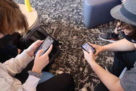 Ryan Walker (‘23) and Alfonso Alvarez Seara (‘23) are seated in the Hooper Center, leaning into a game of Clash Royale. Seated nearby are other students, some passing the time during their free block and others catching up on homework. Both Ryan and Alfonso, not speaking a single word, are nonetheless fully immersed in the game. Ryan can be seen defending an attack from his opponent, his focus locked on his screen, and Alfonso is casually making adjustments to his cards.  