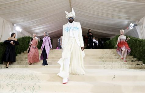 Virgil Abloh is pictured at the 2021 Met Gala on September 13, 2021, in which the theme was “Celebrating In America: A Lexicon of Fashion.” He collaborated with Takashi Murakami to create his outfit. This picture captures just one of his many collaborations.  