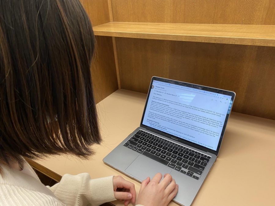 Katharine O’Hearn (‘24) reads Dr. Smith’s email informing students that new protocols will be implemented, effective now. 