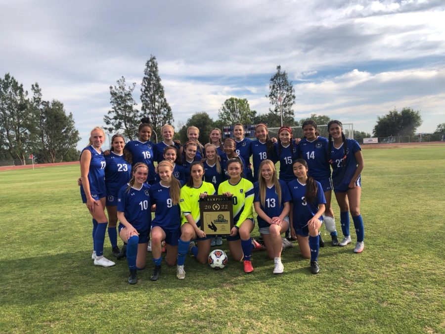 The+team+poses+together%2C+with+the+two+goalies+holding+their+award.+After+an+undefeated+season%2C+winning+the+CIF+championship+award+was+the+perfect+way+to+end+before+they+head+onto+State+championships.+