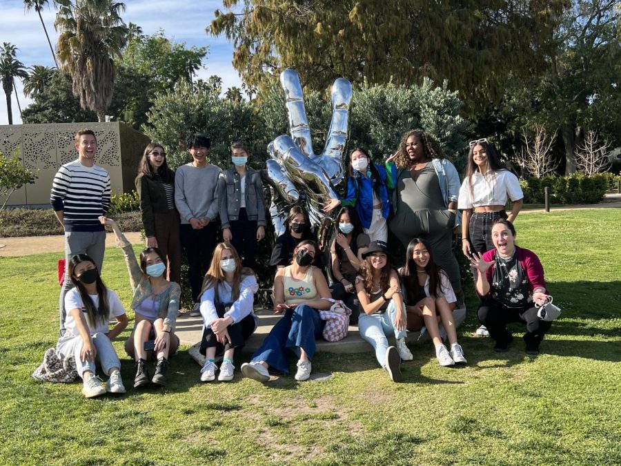 Students on the #FreeBritney unbounded course gather in front of the “Peace and Love” statue in Beverly Hills during a break from their bus tour of Hollywood. During the tour, students saw houses belonging to hundreds of A-list celebrities, including Ringo Starr, who designed the statue.  