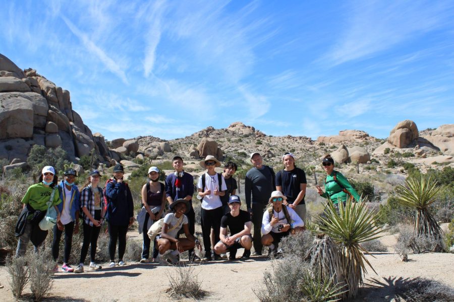 Students+on+the+Arts+Adventure+course+pose+in+front+of+beautiful+scenery+at+Joshua+Tree+National+Park.+The+natural+environment+created+the+perfect+inspiration+for+students+to+develop+ideas+for+potential+art+projects.+Many+people+sketched+the+trees+or+took+pictures+of+the+boulders.%0AKarma+Griggs+%28%E2%80%9823%29