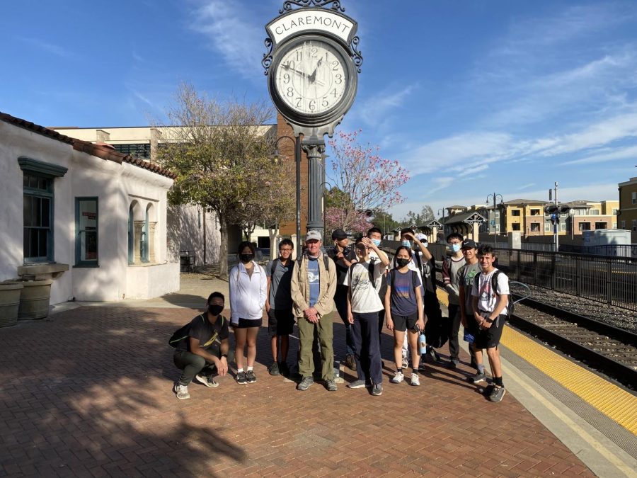 Students+on+the+Hiking+LA+Unbounded+pose+in+front+of+a+tall+clock+in+Claremont%2C+with+Dr.+Lofgren+as+their+guide.+They+wear+hiking+shoes%2C+and+carry+water+bottles%2C+excited+for+a+long+day+of+exploring+together.%0ACredit%3A+Nathan+Silva