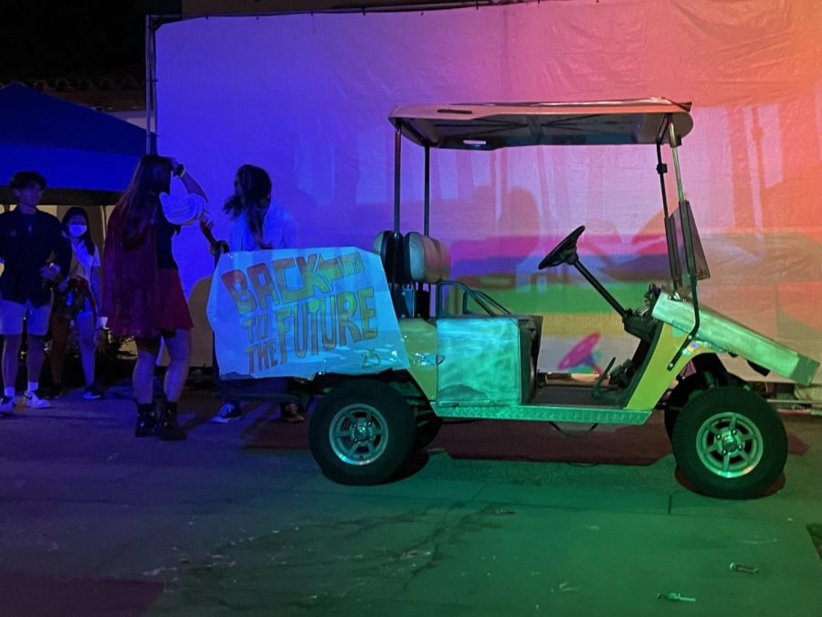 Class of 2025’s time machine golf cart inspired by “Back to the Future” takes Red Riding Hood, played by Rebecca Sobel-Sperry (‘25), and the audience back to the 80s.  