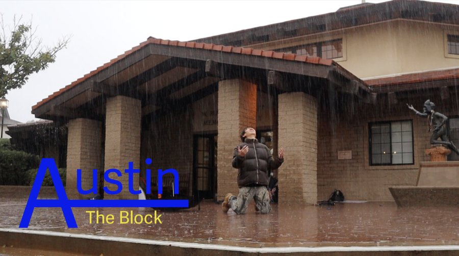 Austin+Ra+%2823%29+kneels+as+intense+rain+falls+down+on+him.+Austin+poses+in+front+of+Fawcett+Library+on+a+rainy+day+for+his+new+episode+of+Austin+on+the+Block.+
