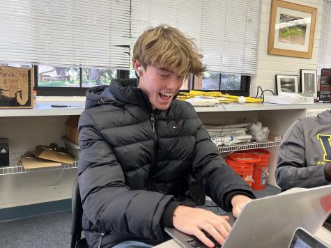 Maksym Graham (23) listens to music during a work period in AP Environmental Science. He beams with excitement as his playlist matches his mood perfectly. You could experience the same excitement by clicking on the link and finding your perfect playlist.