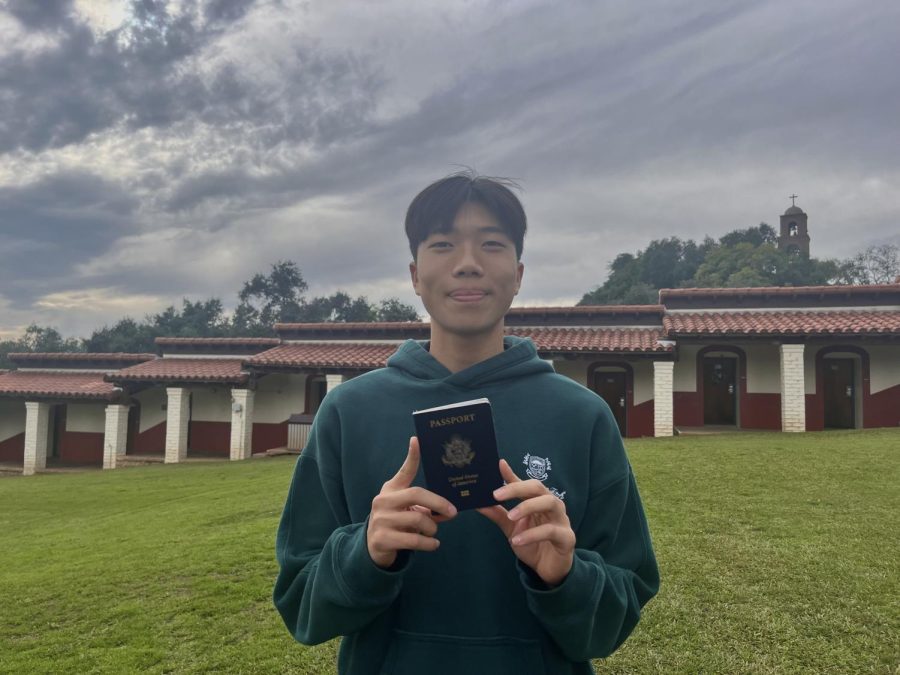 Standing+in+his+dorm%2C+Alamo%2C+Daniel+Hu+%28%E2%80%9823%29+grins+while+holding+up+his+American+passport.+A+Shanghai+native%2C+Daniel+has+not+been+home+since+August+7th%2C+2021%2C+which+is+also+the+last+date+he+saw+his+dad+and+grandparents+who+live+in+China.+This+is+due+to+the+zero-Covid+policy+in+China+that+has+barred+foreigners+from+entering+China+for+the+past+two+years+without+long+quarantine+requirements.+Upon+learning+about+the+callback+of+China%E2%80%99s+zero-Covid+policy%2C+Daniel+booked+a+ticket+back+home+for+spring+break%2C+ecstatic+to+finally+be+able+to+use+his+passport.