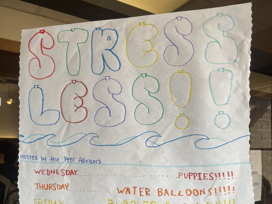 Stress less Week poster in library entrance. Peer Advisors are ready and excited to preform stress less week activities. 