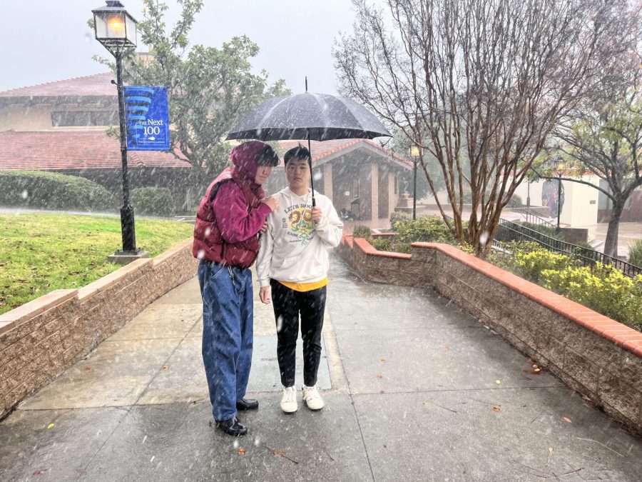  Austin Ra (‘23) and Clarence Deng (‘23) try to stay dry while walking to grab a quick bite from the dining hall. 