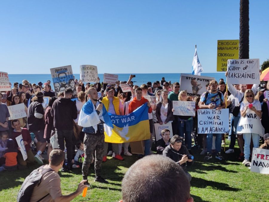 A+crowd+of+people+gather+with+signs+and+raise+the+Ukrainian+flag+to+protest+the+Russian+invasion+of+Ukraine.+On+January+17th%2C+2023%2C+Russian+emigrants+held+rallies+in+support+of+the+Russian+opposition+leader%2C+Alexei+Navalny%2C+two+years+after+he+was+detained+and+sentenced+to+three+and+a+half+years+in+prison.