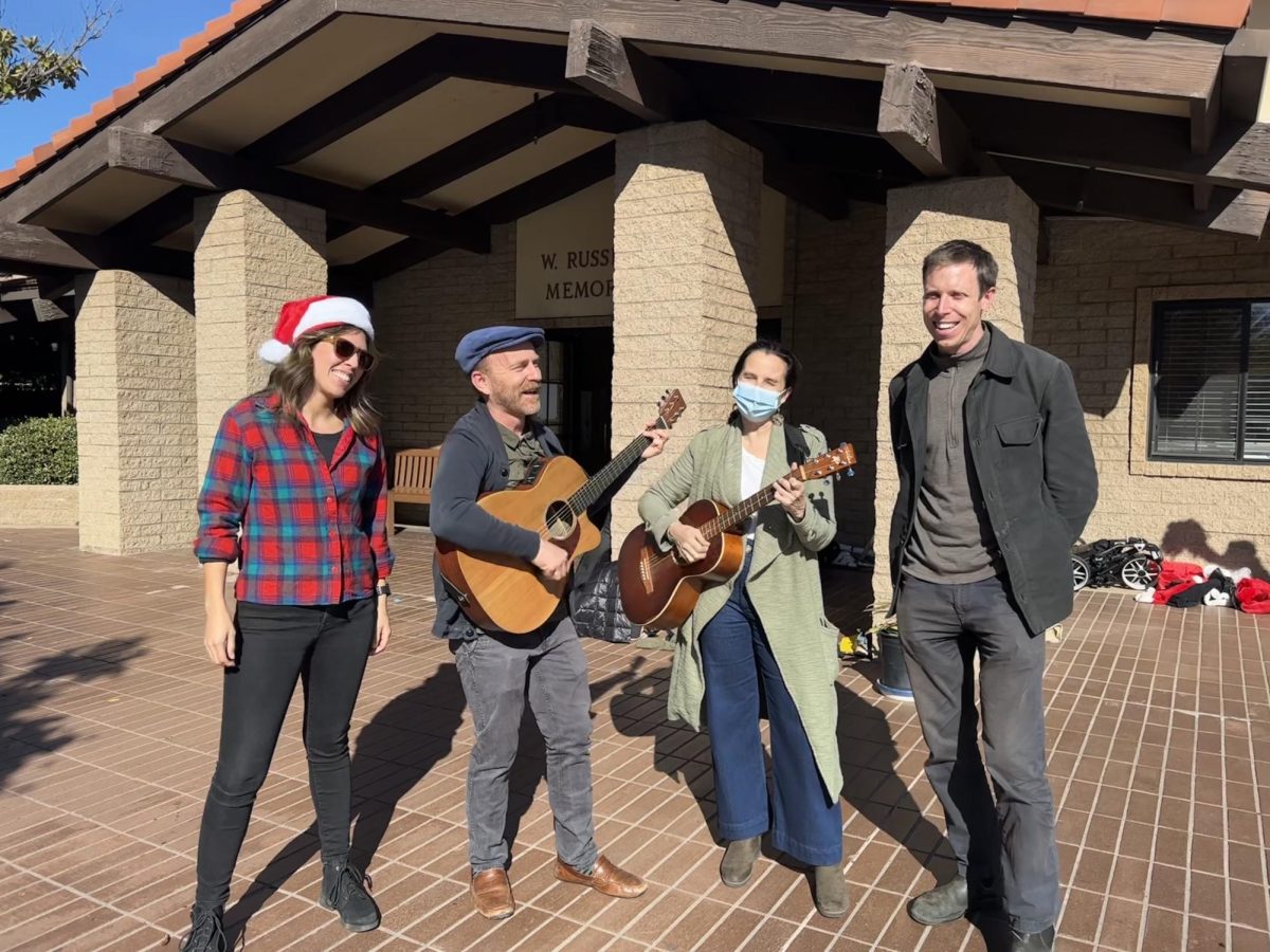 Standing in front of the Fawcett Library, from left to right, Dr. Zambrano, Dr. Dzula, Ms. Cardalliaguet, and Mr. Vincent play the guitar and sing Christmas carols as students stroll by. Showcasing their holiday spirit, these teachers take the time from their lunch break to up-lift the Webb community through song during the final days before break.  