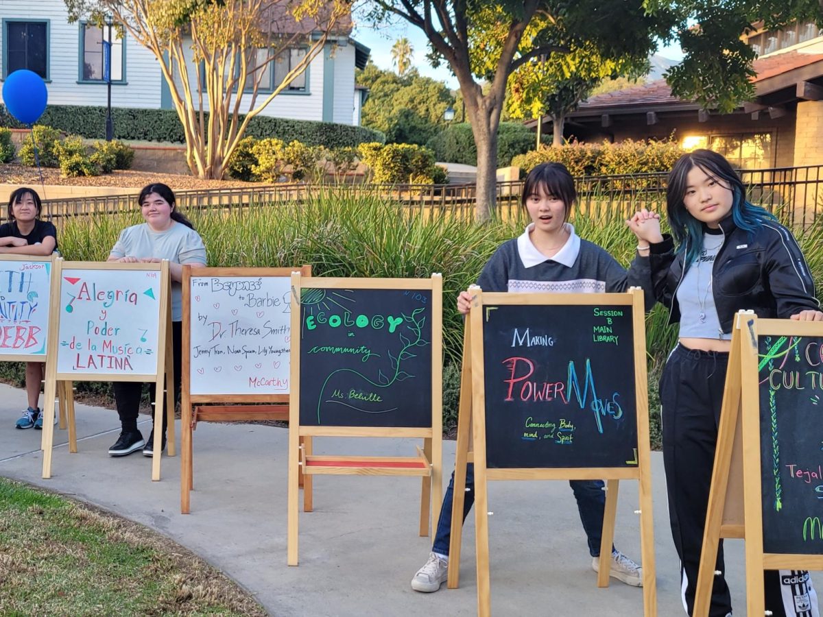 From left to right: Dr. Ardina Greco, Melissa Mani, Bella Choi, Madison Gutierrez, Katherine OHearn, and Maven Li stand behind the signs for the various workshops during the Diversity and Community Symposium. Many of these workshops were piloted by members of Webb’s community — including both faculty and students. It was part affinity, part open to everyone, really if you were interested and you wanted to talk about it with people, it was open to you,” said Gretel Barsotti, Assistant Director of Diversity. 