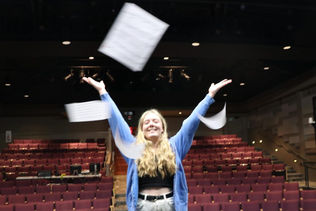 Emily Berg (‘24) throws her sheet music in the air as she practices for auditions. Having been in theater productions since she was six, Emily is an expert on the auditioning process. “Honestly, the easiest part of auditioning for me is just showing up,” Emily said. “Its a lot of fun to sing on stage.” While Emily’s audition date is under wraps, auditions for the musical begin on Monday, January 22nd. 