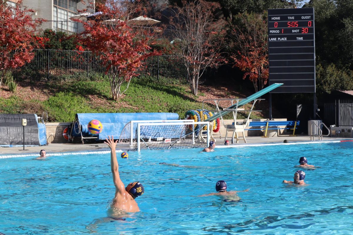 After the intense six on five drills, the players cool down with ball-passes, while some take advantage of the open goal to practice their shooting skills. Quick, clean passes are key in water polo, a game dependent on accuracy and speed. 