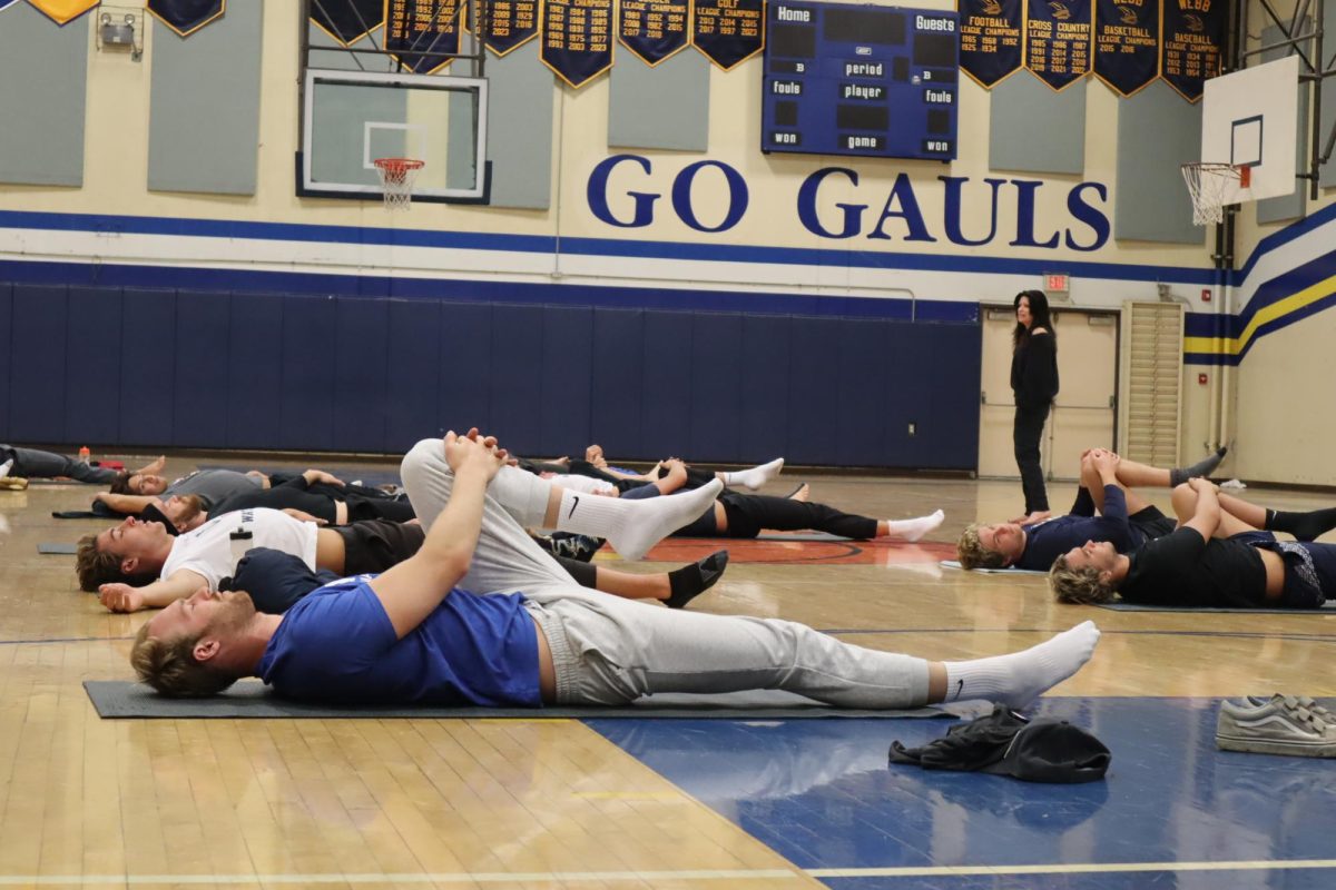 The athletes began their morning with yoga in the Les Perry Gym. Under the guidance of the yoga coach, the national water polo team warmed up their bodies from their shoulders down to their hamstrings. 