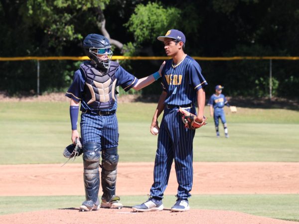 Starting pitcher and fourth in the batting lineup Ayan Kaushal (‘24) receives wise words from catcher Mikey Pino (‘26) to help kick off the game with a quick inning. Kaushal, this year's baseball team captain, communicates with his catcher with confidence and calmness to ensure that all throw calls are understood and the inning goes by smoothly. The WSC Gauls played a strong first playoff game against Calvary Chapel, winning in the last inning 4-3.  