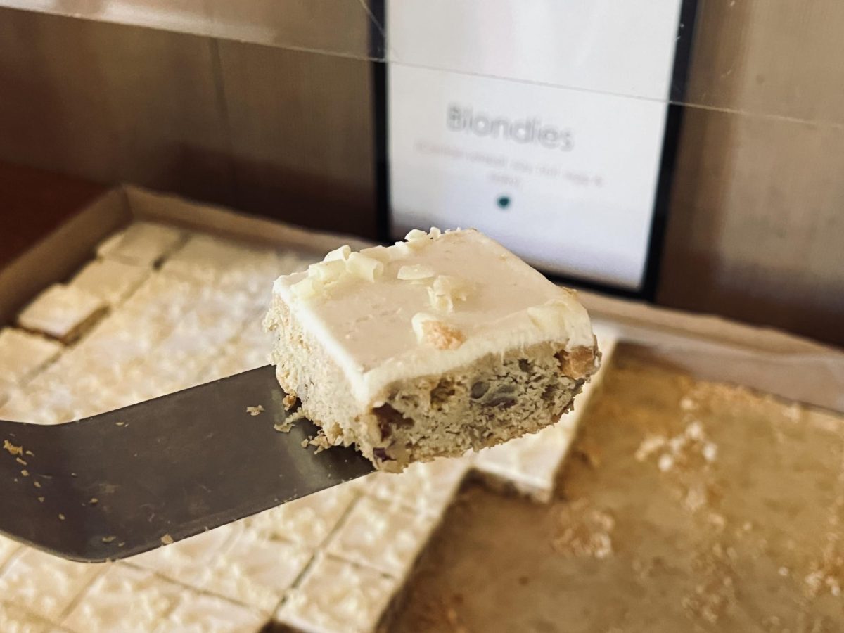 A slice of the new blondie gets taken from the desert table. With a layer of sweet frosting on top and nuts instead of caramel, the new blondie reflects the dining hall’s shift to catering more local foods. “We used to buy it from a large supplier,” said Armando Amezcua, Director of Food Services. “We now import the new blondies from a local bakery from Orange County.” Blondies being one of them, Webb is changing a lot of its old traditions.  