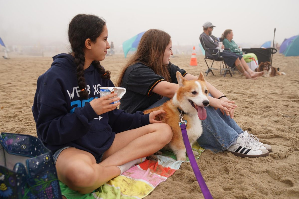 Annalise Centeno (’26) and Ella Berg (’26) peacefully sit on Huntington Beach with the company of Dr Nguyen’s corgi, Ein. Although the weather was foggy, the beach was still filled with other corgis and attendees. “I really enjoyed relaxing on the beach near the ocean, along with the company of so many puppies,” Annalise Centeno (’26) said. The event was a huge success. 