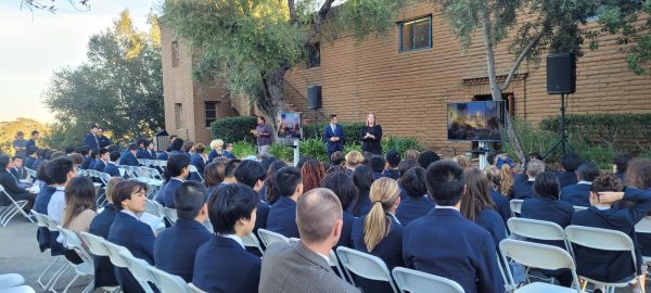 Sarah Lantz, Dean of Students, and Micheal Hoe, Assistant Head of School, explain procedures for the Honor Pledge Ceremony to students sitting outside the chapel. This is the first time students have had to sit outside to accommodate the larger number of students in a co-ed ceremony. “We had new signers for the Honor Pledge and escorts sit outside the chapel and watch the ceremony on TVs, which was a new addition this year,” said Scott Wishek (‘25), chair of the honor council.  